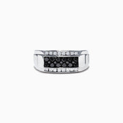 The Mens 14K White Gold Black and White Diamond Ring, 0.96 TCW, showcases a central row of black diamonds bordered by white diamonds in a rectangular design, all set on a polished white gold band.