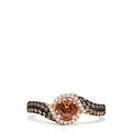 The 14K Rose Gold Espresso and White Diamond Ring, 0.93 TCW, features a round espresso diamond center, a halo of white diamonds, and a twisted band adorned with brown and white diamonds.