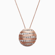 The Pave Rose 14K Rose Gold Diamond Pendant (1.91 TCW) features a round pendant with alternating wavy diamond and polished rows, hanging on a delicate chain against a white background.