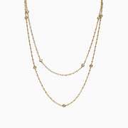 The DOro 14K Yellow Gold Diamond Station Necklace, 1.35 TCW, features small round diamonds spaced evenly along double layers for an elegant, minimalist style.