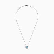 A 14K white gold pendant featuring a heart-shaped aquamarine surrounded by diamonds (2.90 TCW), displayed against a white background.
