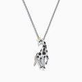 The Safari Sterling Silver Black Diamond Giraffe Pendant (0.13 TCW) features black spots, a green eye, and a gold-accented tail—part of the Effy Safari collection.