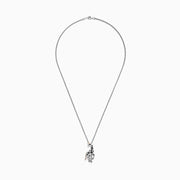 The Safari Sterling Silver Black Diamond Giraffe Pendant (0.13 TCW) features black spots, a green eye, and a gold-accented tail—part of the Effy Safari collection.