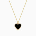 The 14K Yellow Gold Onyx and Diamond Heart Pendant features a heart-shaped onyx accented with sparkling diamonds, all set on a classic yellow gold chain for an elegant touch.