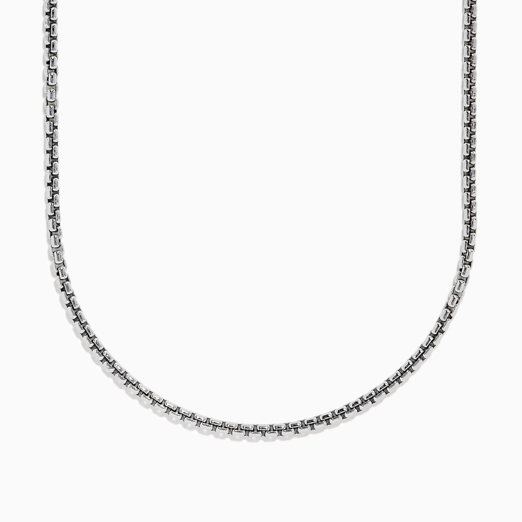 A close-up of the Mens Sterling Silver 21 Box Link Chain shows its sleek box chain design, displayed on a white background and curving gently at the bottom.