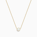 The Aurora 14K Yellow Gold Bezel Set Opal Necklace (0.55 TCW) features a round white opal pendant on a delicate gold chain—an elegant piece from the Effy Aurora collection.