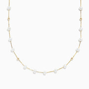 The 14K Yellow Gold Freshwater Pearl Necklace features small white pearls and gold beads arranged alternately along a delicate yellow gold chain, offering a simple yet elegant design in classic Effy style.