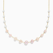 The 14K Yellow Gold Multi Color Pearl Necklace features alternating white and light pink pearls along the chain, shown on a plain white background.