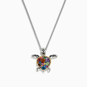 The Seaside Sterling Silver Multi Gemstone Turtle Pendant (2.00 TCW) features a heart-shaped shell on a silver chain, showcased against a white background.