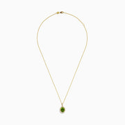 The 14K Yellow Gold Peridot and Diamond Pendant features a round peridot accented by sparkling diamonds, all set in yellow gold for a radiant look.