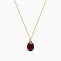 The Bordeaux 14K Yellow Gold Garnet and Diamond Pendant (4.68 TCW) features a fine chain and a striking oval deep red garnet accented by sparkling diamonds above the stone.