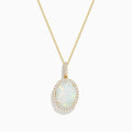 The Aurora 14K Yellow Gold Opal and Diamond Pendant features a stunning oval opal surrounded by sparkling diamonds, presented on a simple white background.