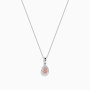 An 18K two-tone gold necklace featuring a pear-shaped pendant with pink and white diamonds (0.18 TCW) on a delicate chain. Set against a white background.