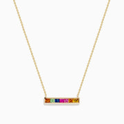 The Watercolors 14K Yellow Gold Multi Sapphire Bar Necklace features a horizontal bar pendant with six vibrant rectangular sapphires, crafted in 14K yellow gold for a timeless, elegant look.