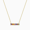 The Watercolors 14K Yellow Gold Multi Sapphire Bar Necklace, 0.93 TCW, features a delicate gold bar with six rainbow-arranged sapphires set in a horizontal rectangular pendant.