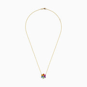 The Watercolors 14K Gold Multi Sapphire and Diamond Flower Necklace features a gold chain and a diamond flower pendant accented with eight colorful, teardrop-shaped sapphires arranged in a circle.