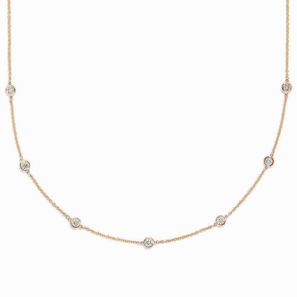 The DOro 14K Yellow Gold Diamond Station Necklace, 0.69 TCW, features a fine gold chain with evenly spaced bezel-set round diamonds for a delicate and elegant look.