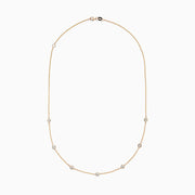 The DOro 14K Yellow Gold Diamond Station Necklace, 0.69 TCW, features a fine gold chain with evenly spaced bezel-set round diamonds for a delicate and elegant look.