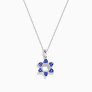 The Nahla Siri 14k Gold Star of David Pendant features tanzanite and diamond accents, displayed on a white background.
