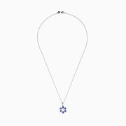 The Nahla Siri 14k Gold Star of David Pendant features tanzanite and diamond accents, displayed on a white background.