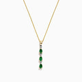 A 14k yellow gold pendant by Effy, featuring three emeralds and four diamonds (0.57 TCW) in an alternating vertical design, hangs from a delicate chain for an elegant look.