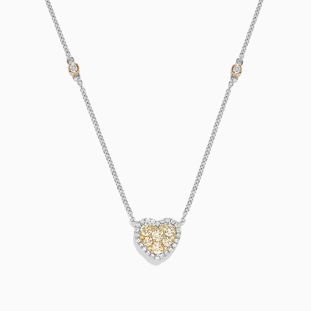 The Canare 14K Two Tone Gold Yellow Diamond Heart Necklace (0.71 TCW) features a heart-shaped pendant with yellow and white gemstones and two small round accents on the chain—adding elegance with a touch of Yellow Diamond sparkle.