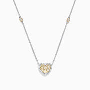 The Canare 14K Two Tone Gold Yellow Diamond Heart Necklace (0.71 TCW) features a heart-shaped pendant with yellow and white gemstones and two small round accents on the chain—adding elegance with a touch of Yellow Diamond sparkle.