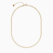 The 14K Yellow Gold Bead Necklace features evenly spaced, small spherical beads on a delicate chain, shown against a white background for a simple, elegant look.
