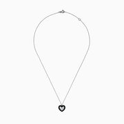 The Novelty 14K White Gold Black Enamel & Diamond Heart Pendant, 0.18 TCW, hangs from a delicate silver chain and features a heart outlined in black enamel with sparkling diamonds at the center.