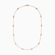 The Pave Rose 14K Rose Gold Diamond Station Necklace 1.50 TCW features evenly spaced round bezel-set diamonds on a rose gold chain, offering timeless elegance and sparkle to any outfit.