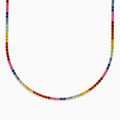 The Watercolors 14K Yellow Gold Multi Sapphire Tennis Necklace features small, round sapphires in a rainbow pattern, elegantly set in yellow gold and arranged in a smooth curve.