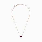 The 14K Rose Gold Ruby Pave Heart Necklace features a heart-shaped pendant encrusted with sparkling rubies on a delicate rose gold chain, displayed against a plain white background.