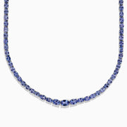 A close-up of the Nahla Siri Sterling Silver Tanzanite Necklace, 27.69 TCW, showcasing a continuous strand of round, faceted blue tanzanite gemstones set symmetrically against a white background.