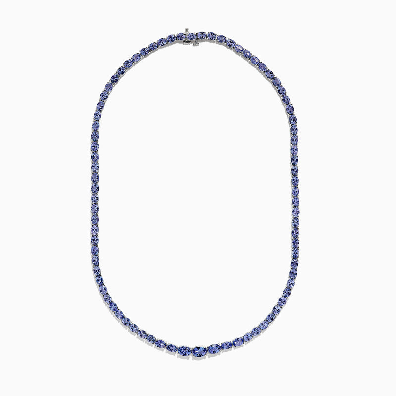 A close-up of the Nahla Siri Sterling Silver Tanzanite Necklace, 27.69 TCW, showcasing a continuous strand of round, faceted blue tanzanite gemstones set symmetrically against a white background.