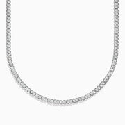 A close-up of the 925 Sterling Silver Diamond Tennis Necklace showcases its continuous row of sparkling round diamonds in a simple, elegant design against a white background.