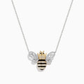 A captivating 14K White Gold White and Black Diamond Bee Necklace, showcasing a bee-shaped pendant adorned with sparkling white and black diamonds atop a delicate chain.