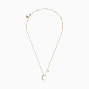 A delicate Novelty 14K Yellow Gold Diamond Moon and Star Necklace, 0.09 TCW, featuring a crescent moon pendant with small gemstones and a diamond-accented star charm.