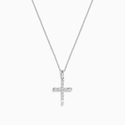A delicate silver necklace features the Novelty 14K White Gold Diamond Cross Pendant, 0.30 TCW, adorned with sparkling diamonds and set against a plain white background.