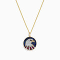 The Novelty 14K Gold Ruby, Sapphire & Diamond Eagle Head Pendant (1.06 TCW) features a round pendant with a stylized eagle head and patriotic background, embellished with ruby, sapphire, and diamond stones.