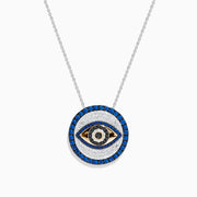 The Novelty 14K Two Tone Gold Sapphire and Diamond Evil Eye Pendant features a round evil eye design with sparkling sapphires and diamonds for a striking look.