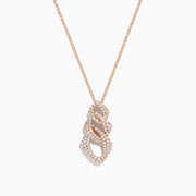 The 14K Rose Gold Diamond Crossover Pendant features an intricate design with sparkling diamonds, showcased on a rose gold chain against a white background.