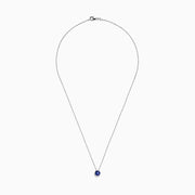 The 925 Sterling Silver Tanzanite Pendant features a delicate sterling silver chain with a tanzanite stone in a simple bezel setting, shown on a white background.