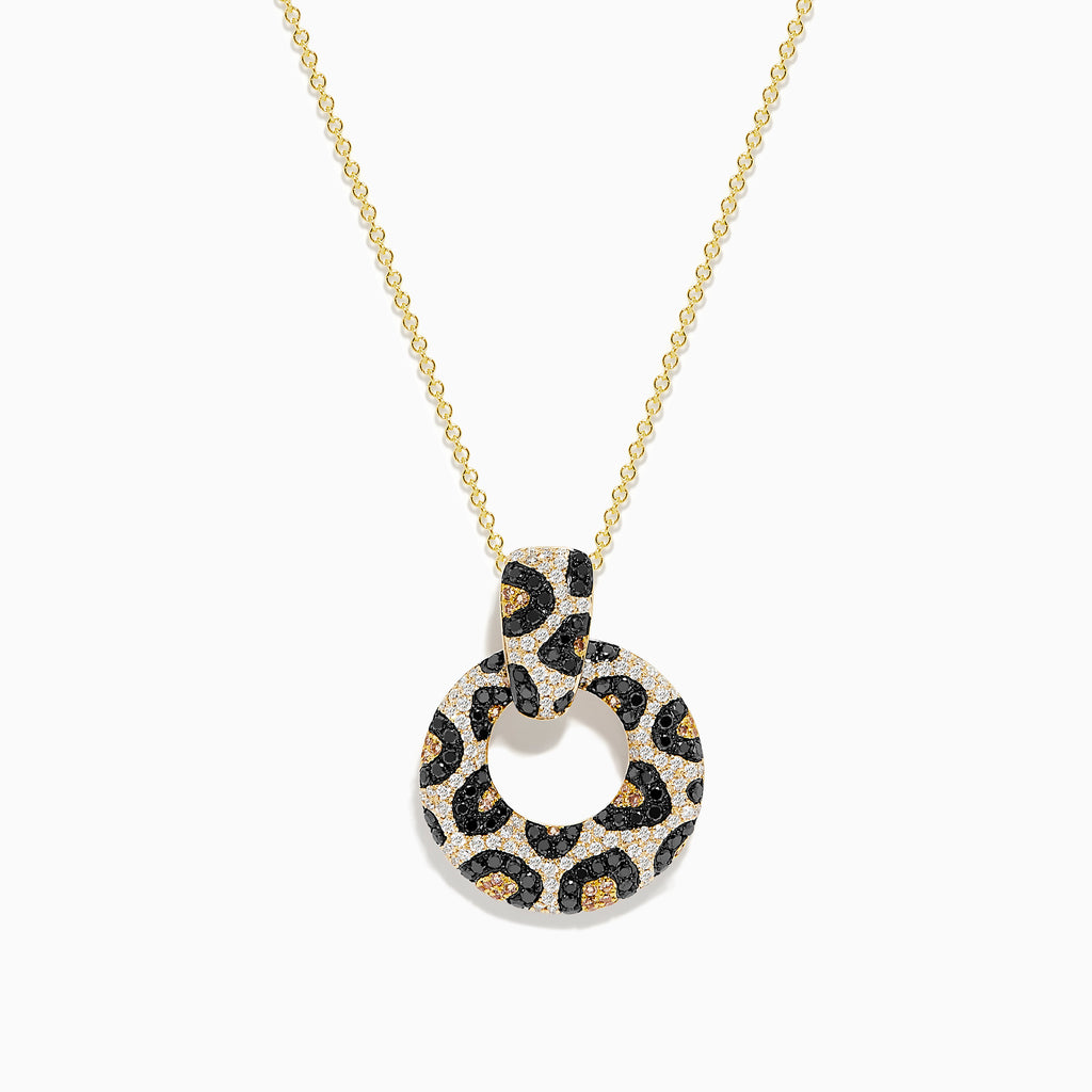 The Signature 14K Yellow Gold Diamond Spot Pendant features a circular design with black, gold, and white gemstones in a leopard print pattern. Its looped diamond detailing stands out beautifully against a plain white background.