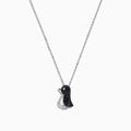 The Safari Sterling Silver Black and White Diamond Penguin Pendant (0.31 TCW) hangs from a delicate chain, its playful penguin design dazzling with black and white diamonds set in sterling silver against a white background.
