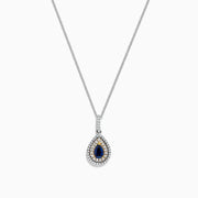 The Royale Bleu 14K Two Tone Gold Sapphire and Diamond Pendant features a teardrop-shaped blue sapphire surrounded by diamonds, set on a silver chain with elegant gold accents, totaling 0.38 TCW.