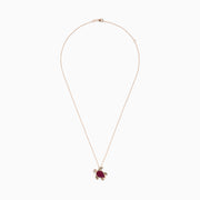 The Seaside 14K Rose Gold Ruby and Diamond Turtle Pendant features a pink ruby-studded shell, detailed gold feet, head, and tail, accented with a sparkling diamond, shown on a white background.