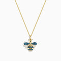 14K Yellow Gold Blue and White Diamond Bee Pendant featuring a bee-shaped design with blue and white diamond gemstones and black accents on the wings and body, showcased against a plain white background.