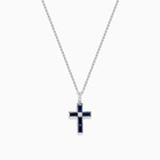 The Royale Bleu 14K White Gold Sapphire and Diamond Cross Pendant features a silver chain and striking dark blue sapphire-like rectangular stones, displayed on a plain white background.