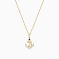 The Seaside 14K Yellow Gold Diamond and Sapphire Anchor Pendant features a yellow gold chain with an anchor-shaped pendant adorned with diamond accents and a sapphire at the top center.