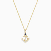 The Seaside 14K Yellow Gold Diamond and Sapphire Anchor Pendant features a yellow gold chain with an anchor-shaped pendant adorned with diamond accents and a sapphire at the top center.